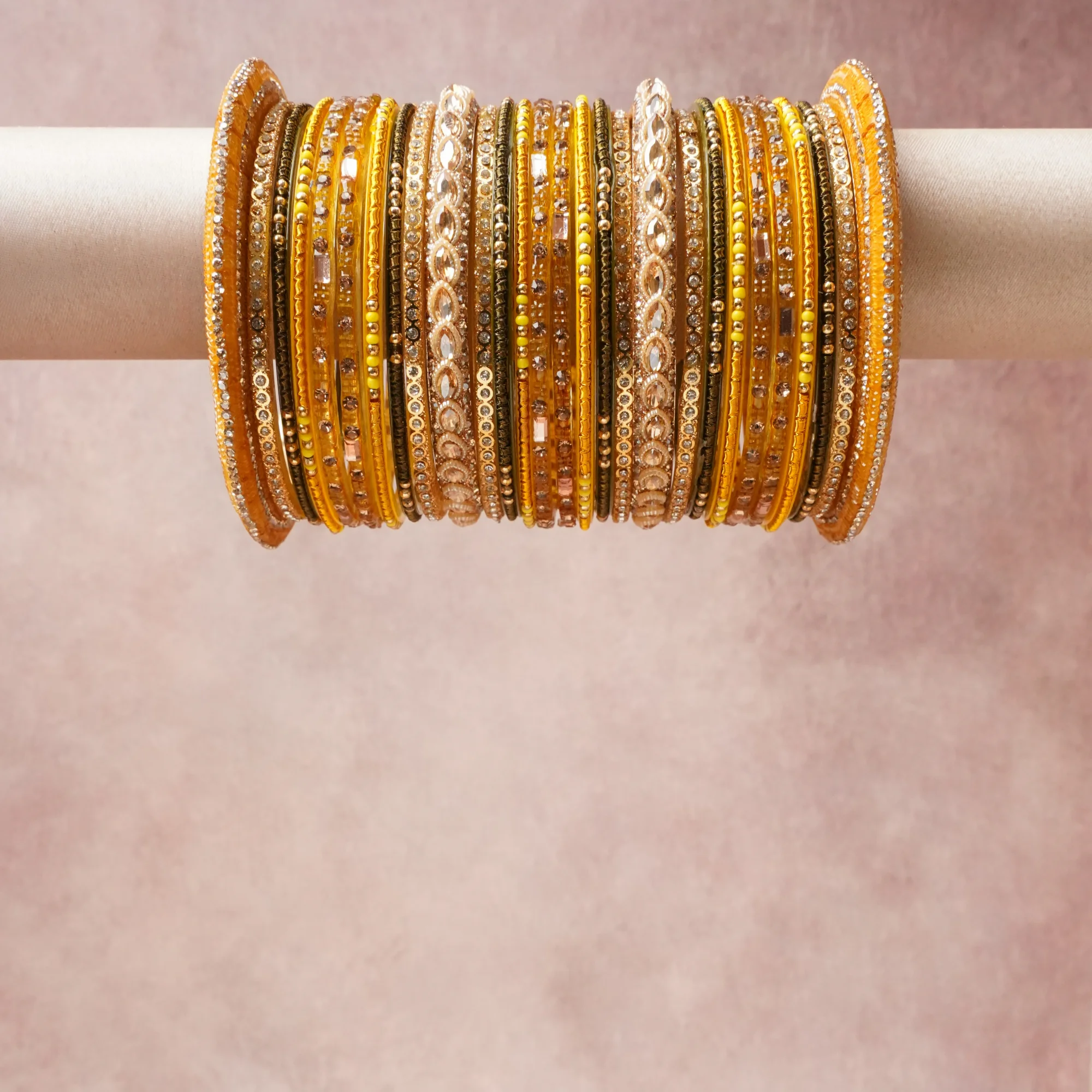 A grounding Goldenrod forms the heart of the set, while touches of Crystal Clear, Rose Pink, Metallic Gold, Olive Green, Terracotta Orange, Clear Crystal, Rose Gold, Pale Chartreuse add charm.

A thoughtful composition of Lac, Glass, Gold-toned Metal, Cubic Zirconia, designed to feel complete without being heavy.
Each element layers seamlessly, creating a look that is refined, wearable and quietly striking.